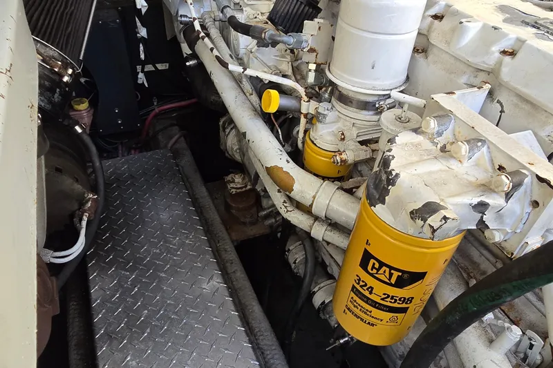 Slide: The Image of Engine compartment of a 2003 Albemarle 320 Express Fisherman with CAT oil filter visible. - 40
