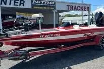 Slide: The Image of 2006 Bullet 21XD boat interior with red and white seats, steering wheel visible. - 11