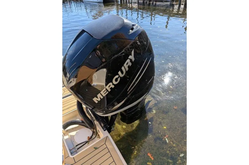 Slide: The Image of Mercury outboard motor on 2017 Rossiter R23 boat in clear water. - 8