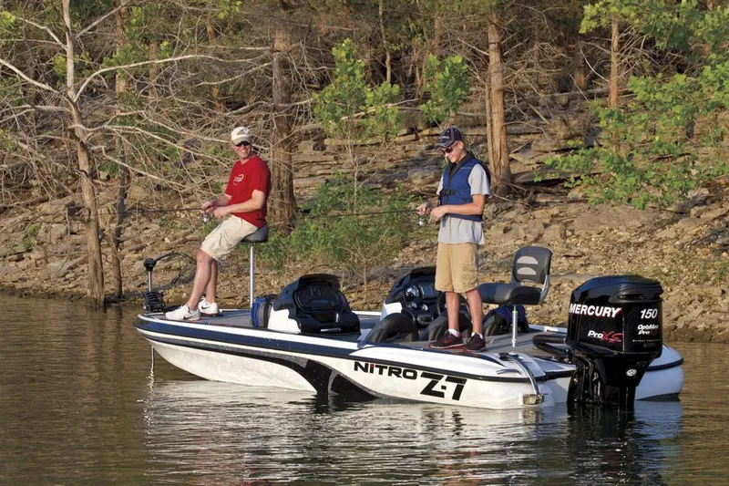 Slide: The Image of 2012 Nitro Z-7 boat interior with steering wheel and dashboard gauges. - 10