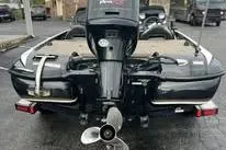 Slide: The Image of 2012 Nitro Z-7 boat displayed at a dealership, featuring dual motors and sleek design. - 2