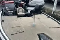 Slide: The Image of 2012 Nitro Z-7 boat, rear view with motor and propeller, parked outdoors. - 3