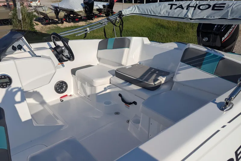 Slide: The Image of 2026 Tahoe T16 boat interior with seating, steering wheel, and modern design. - 69