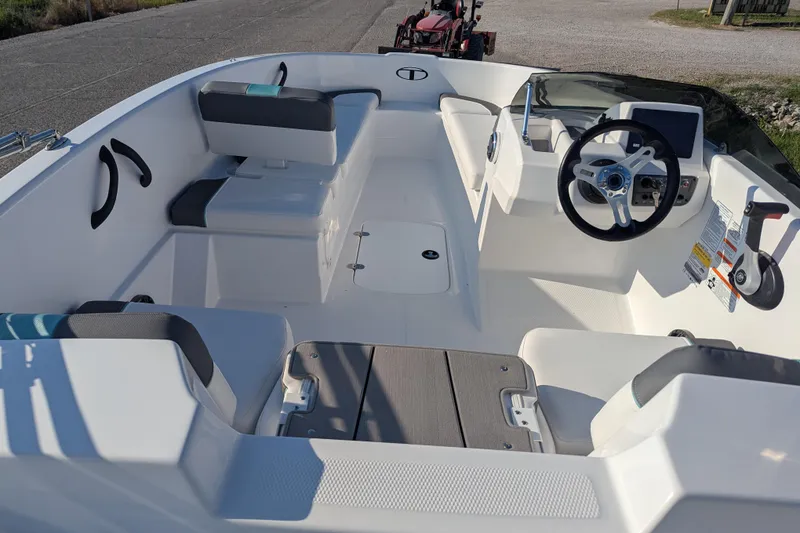 Slide: The Image of 2026 Tahoe T16 boat interior with steering wheel, seating, and control panel. - 73
