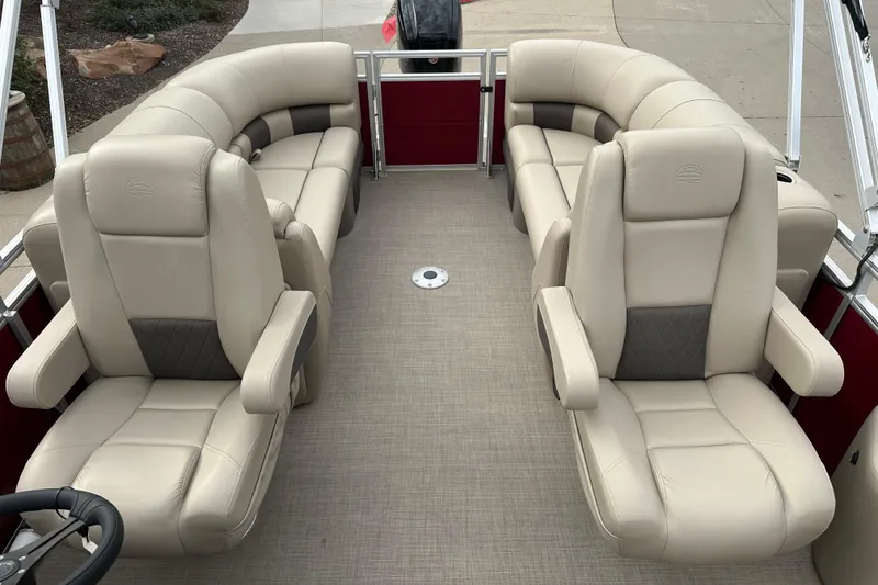 Slide: The Image of 2025 Sun Tracker Party Barge 22 DLX interior with plush seating and modern design. - 7