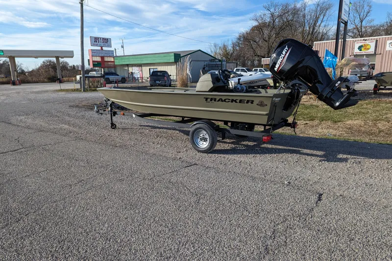 Slide: The Image of 2026 Tracker Grizzly 1648 SC boat on trailer in parking lot. - 28