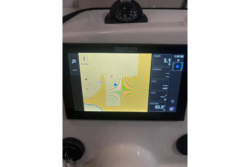Slide: The Image of Simrad navigation display on 2023 Boston Whaler 170 Montauk boat dashboard. - 10