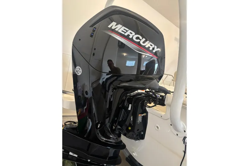 Slide: The Image of 2023 Boston Whaler 170 Montauk with Mercury outboard engine, sleek and powerful design. - 2