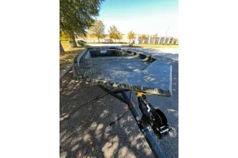 Slide: The Image of 2026 Tracker Grizzly 1754 Utility boat on trailer, parked outdoors. - 5