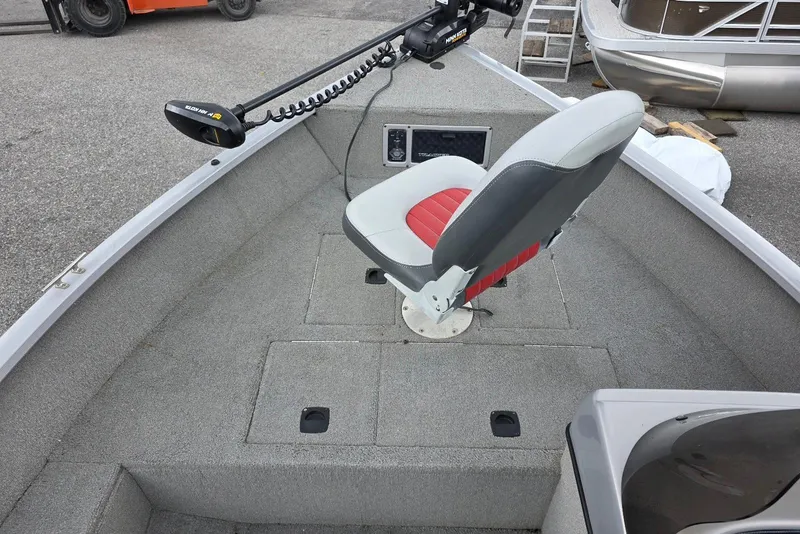 Slide: The Image of 2005 TRACKER BOATS Targa V16 Side Console with red and gray seating, trolling motor. - 8