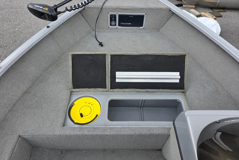 Slide: The Image of 2005 TRACKER BOATS Targa V16 Side Console interior with storage compartments and fishing equipment. - 9