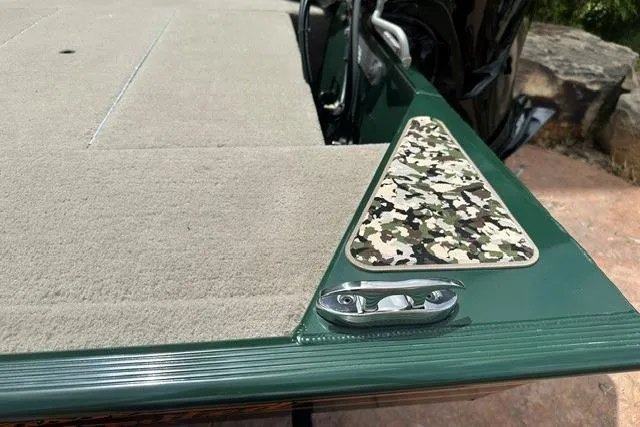 Slide: The Image of 2026 Tracker Bass Tracker Classic Limited boat deck with camouflage detail and cleat. - 13