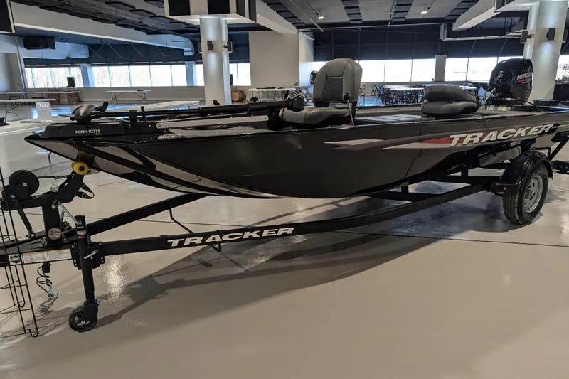 The Image of 2025 Tracker Panfish 17 boat on display indoors, featuring sleek design and modern equipment. - 36