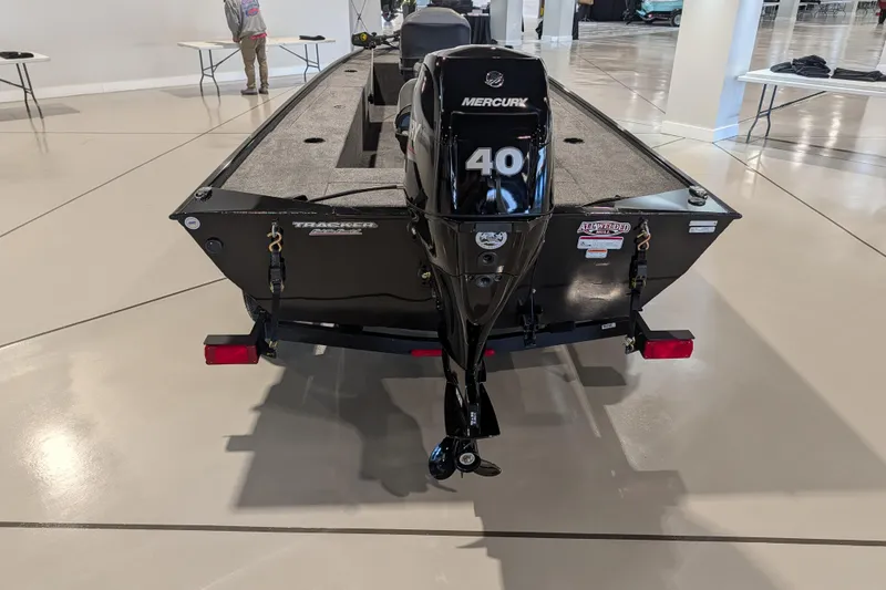 Slide: The Image of 2025 Tracker Panfish 17 boat with Mercury 40 engine displayed indoors. - 39