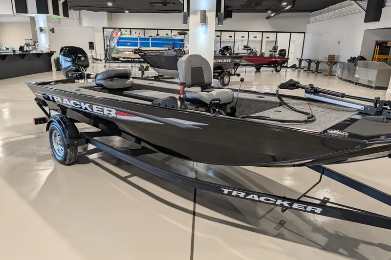 Slide: The Image of 2025 Tracker Panfish 17 boat displayed indoors, featuring sleek design and modern equipment. - 42