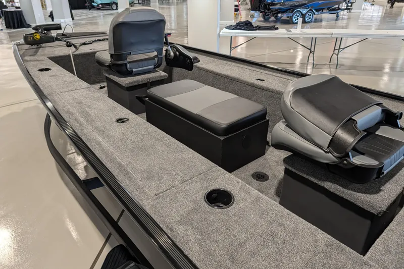 Slide: The Image of 2025 Tracker Panfish 17 boat interior with seating and storage compartments. - 43