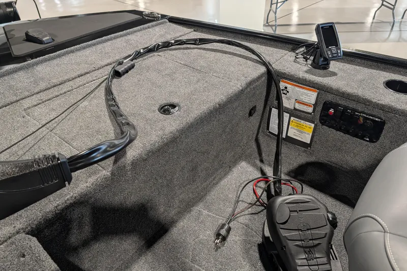 Slide: The Image of 2025 Tracker Panfish 17 boat interior with control panel and wiring. - 45