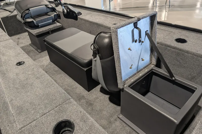 Slide: The Image of 2025 Tracker Panfish 17 boat interior with storage compartments and seating. - 47