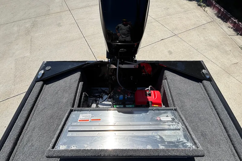 Slide: The Image of 2026 Tracker Bass Tracker Classic XL boat engine compartment with battery and fuel tank. - 9