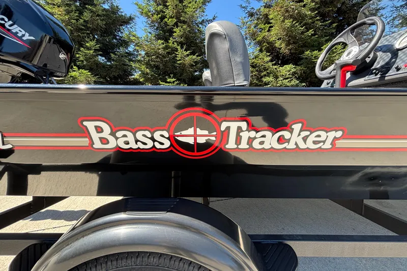 Slide: The Image of 2026 Tracker Bass Tracker Classic XL boat with logo, parked outdoors. - 29