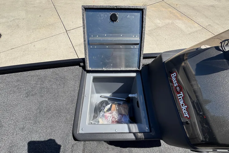 Slide: The Image of Open storage compartment in 2026 Tracker Bass Tracker Classic XL boat. - 11