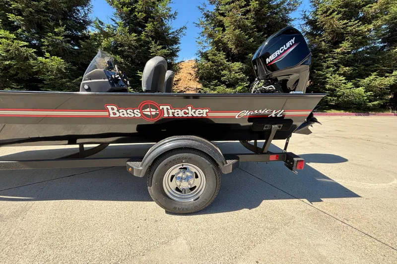 Slide: The Image of 2026 Tracker Bass Tracker Classic XL boat on trailer with Mercury engine. - 36