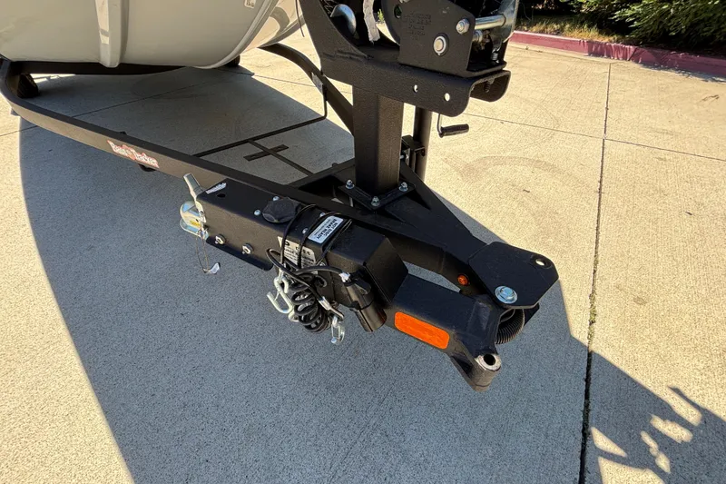 Slide: The Image of Trailer hitch of 2026 Tracker Bass Tracker Classic XL boat on pavement. - 40