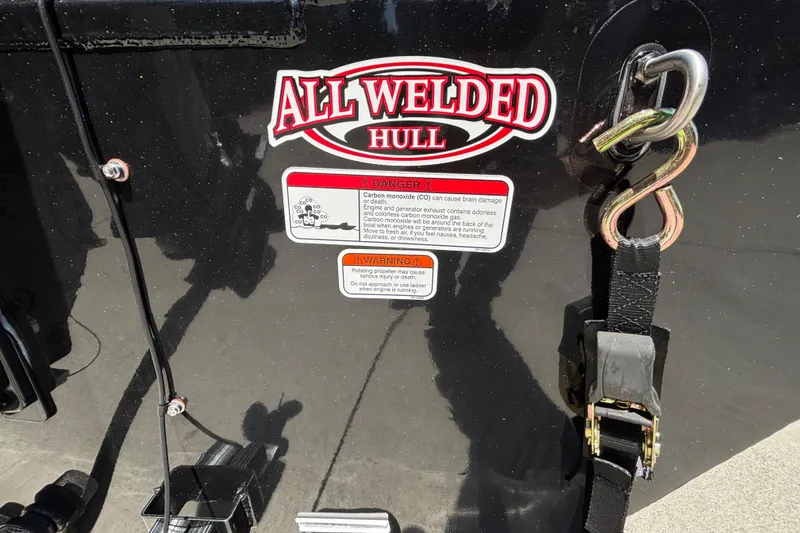 Slide: The Image of 2026 Tracker Bass Tracker Classic XL with "All Welded Hull" label and safety warnings. - 31