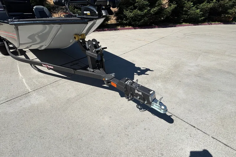 Slide: The Image of 2026 Tracker Bass Tracker Classic XL boat trailer hitch on concrete surface. - 27