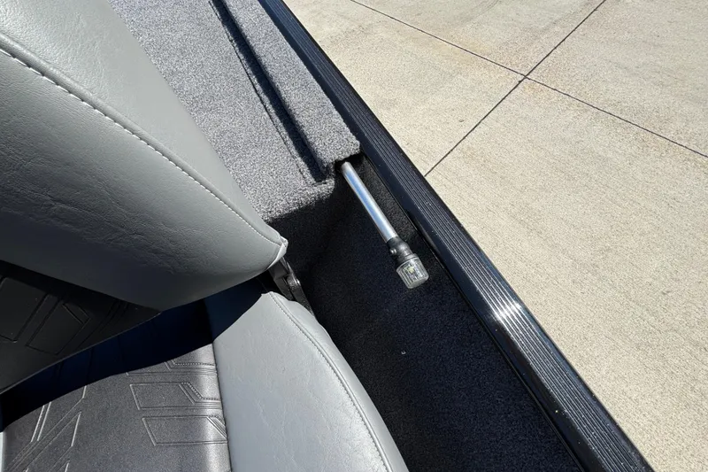 Slide: The Image of 2026 Tracker Bass Tracker Classic XL interior detail with gray upholstery and metal support. - 26