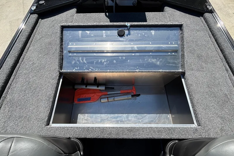 Slide: The Image of Open storage compartment in 2026 Tracker Bass Tracker Classic XL boat. - 10
