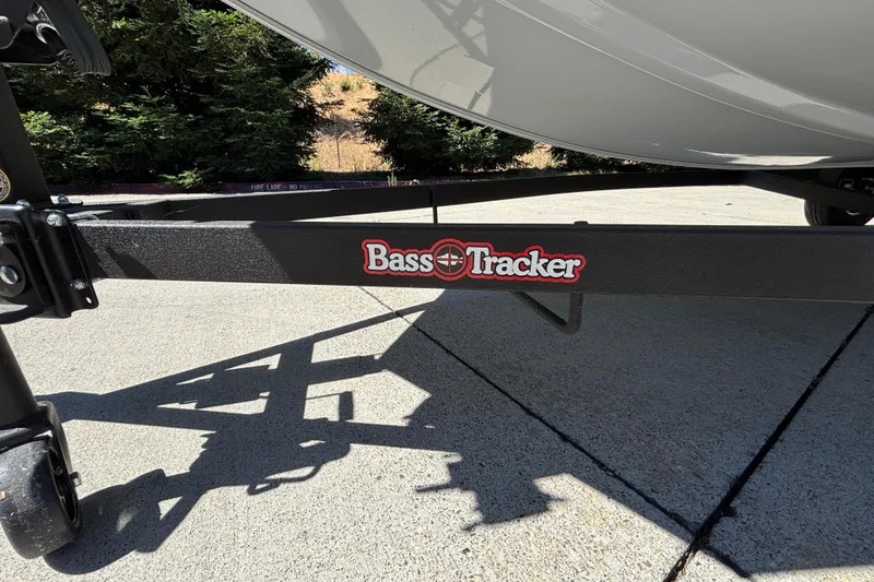 Slide: The Image of 2026 Tracker Bass Tracker Classic XL trailer with logo, parked on concrete. - 35