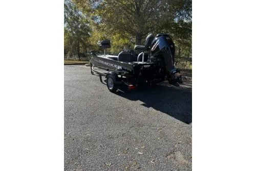 Slide: The Image of 2026 Tracker Pro 170 boat on trailer in outdoor setting. - 2