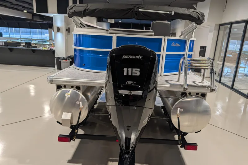 Slide: The Image of 2026 Sun Tracker Party Barge 20 DLX with Mercury 115 engine, displayed indoors. - 70