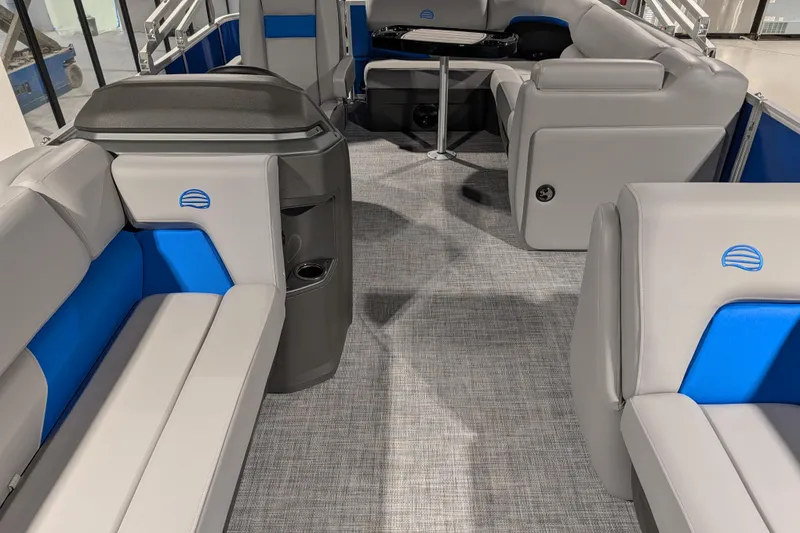 Slide: The Image of 2026 Sun Tracker Party Barge 20 DLX interior with gray and blue seating. - 81