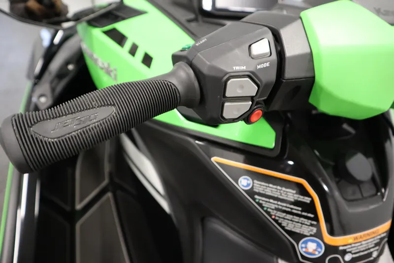 Slide: The Image of Close-up of 2023 Kawasaki 310LX-S Ultra handlebar controls and grip. - 13