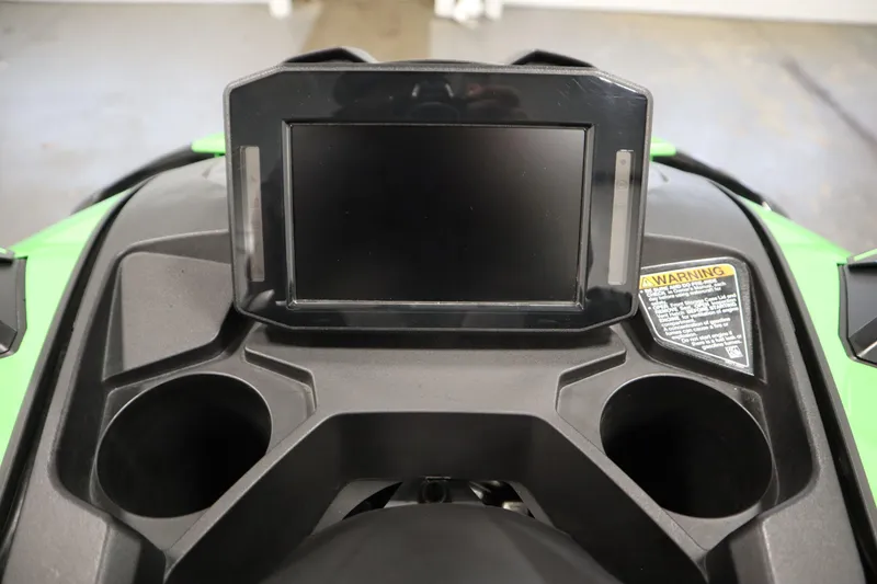 Slide: The Image of 2023 Kawasaki 310LX-S Ultra dashboard with display screen and cup holders. - 15