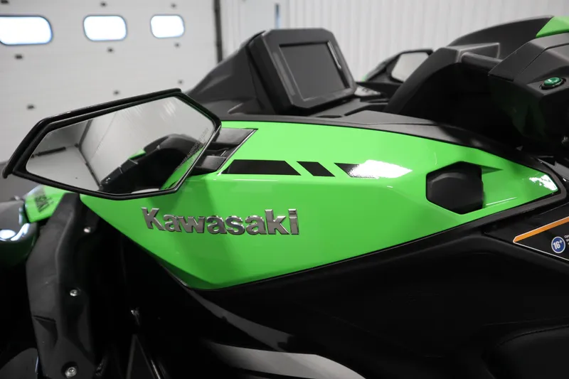 Slide: The Image of 2023 Kawasaki 310LX-S Ultra, green body with side mirror, close-up view. - 16