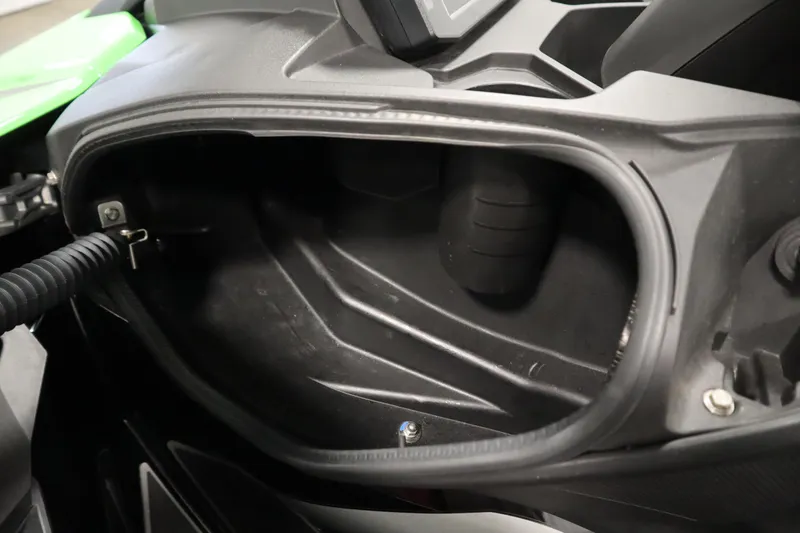 Slide: The Image of 2023 Kawasaki 310LX-S Ultra storage compartment, showcasing interior design and space. - 17
