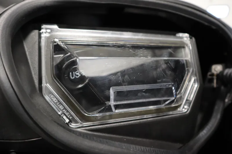 Slide: The Image of 2023 Kawasaki 310LX-S Ultra dashboard with USB port, close-up view. - 19
