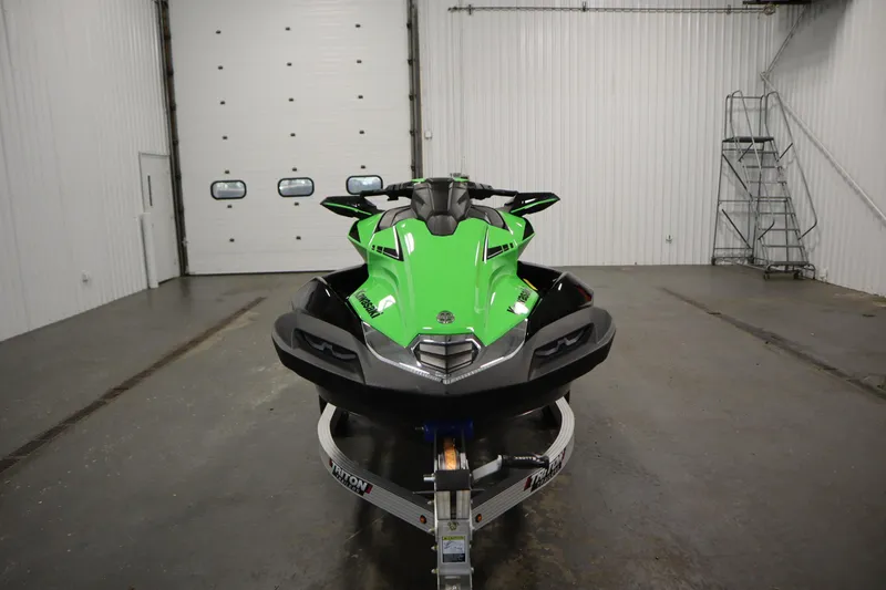 Slide: The Image of 2023 Kawasaki 310LX-S Ultra jet ski in a garage, front view. - 2