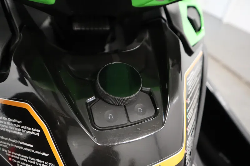 Slide: The Image of Control panel of 2023 Kawasaki 310LX-S Ultra jet ski, featuring buttons and a dial. - 21