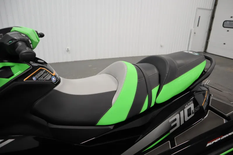 Slide: The Image of 2023 Kawasaki 310LX-S Ultra jet ski seat with green and black design. - 22
