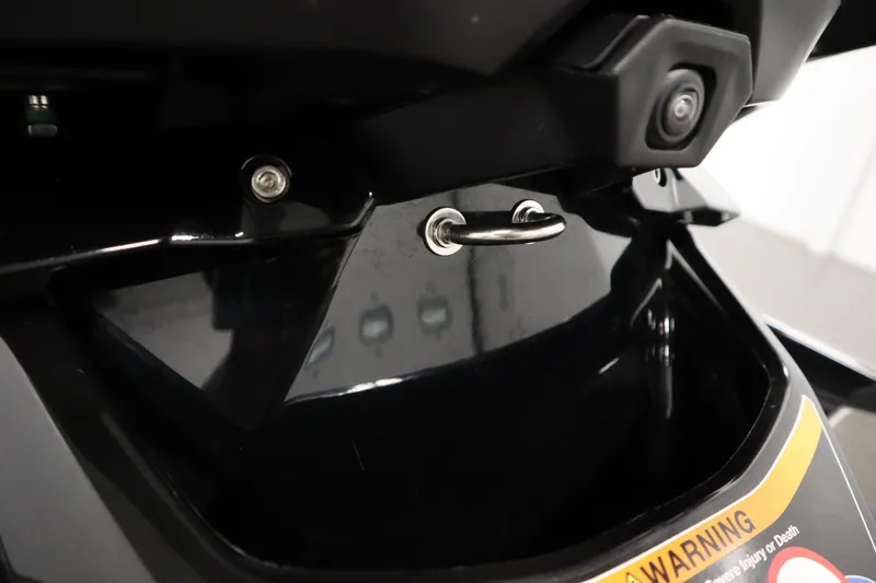 Slide: The Image of 2023 Kawasaki 310LX-S Ultra close-up of rear hook and warning label. - 24