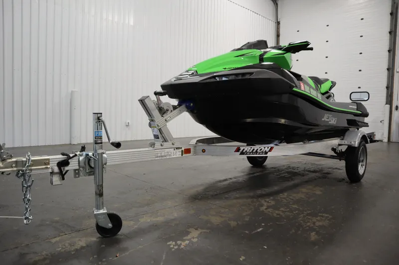 Slide: The Image of 2023 Kawasaki 310LX-S Ultra jet ski on Triton trailer in a garage. - 29