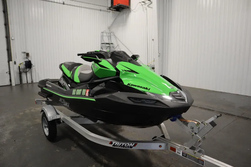 Slide: The Image of 2023 Kawasaki 310LX-S Ultra jet ski on trailer in a garage. - 3