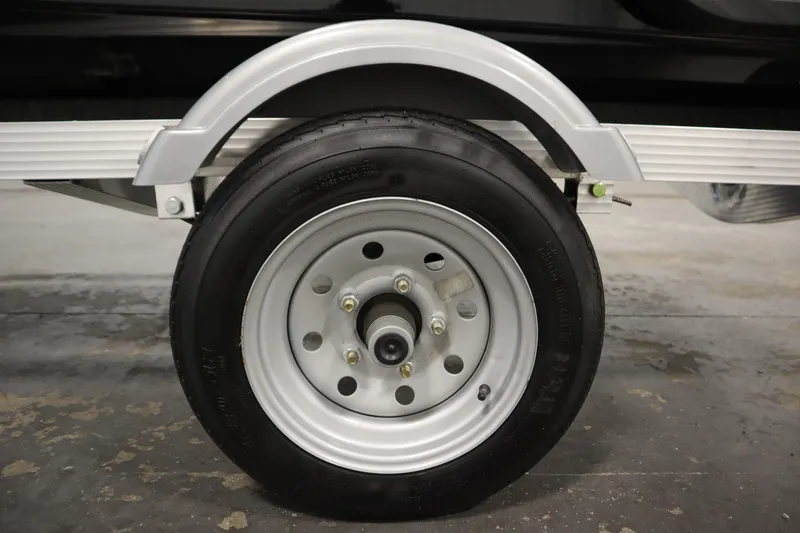 Slide: The Image of Close-up of a 2023 Kawasaki 310LX-S Ultra trailer wheel on concrete floor. - 30