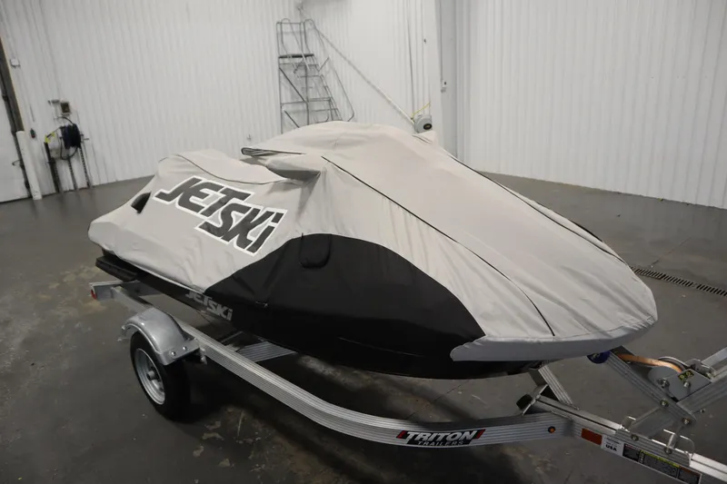 Slide: The Image of 2023 Kawasaki 310LX-S Ultra jet ski covered on trailer in garage. - 31