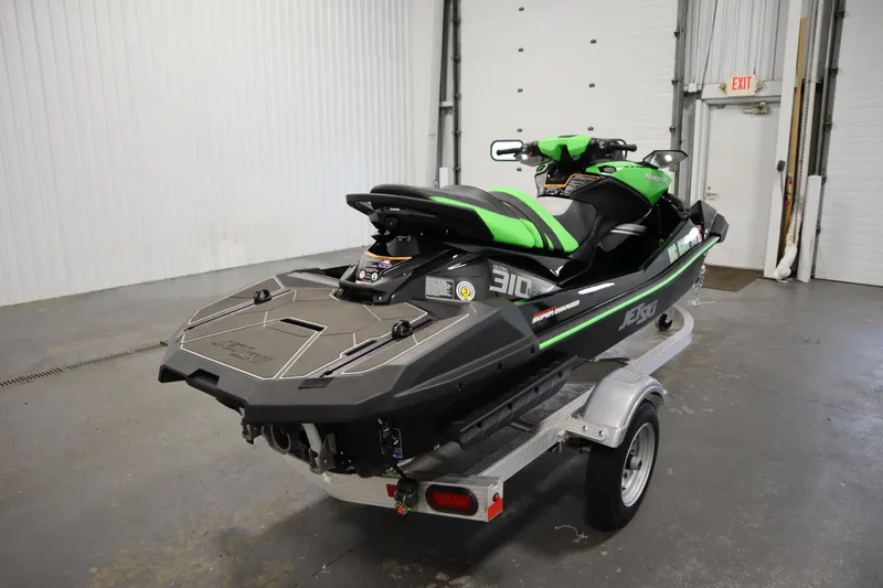Slide: The Image of 2023 Kawasaki 310LX-S Ultra jet ski on trailer in garage setting. - 5