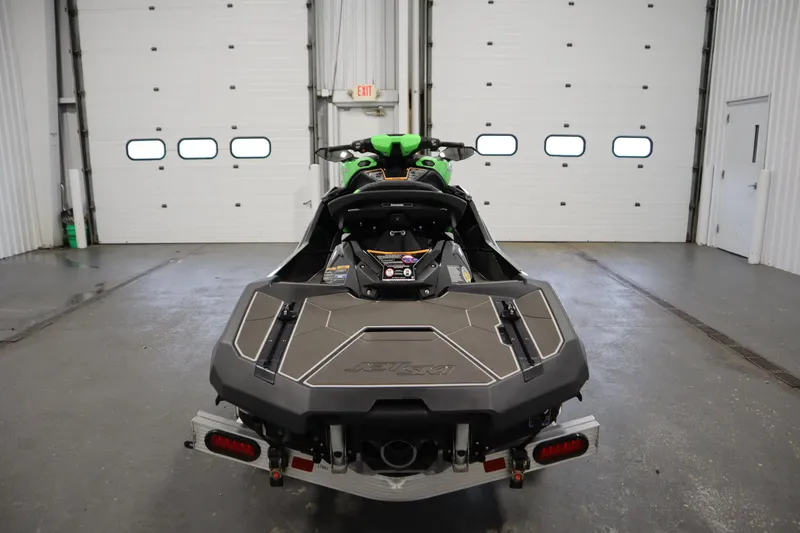 Slide: The Image of 2023 Kawasaki 310LX-S Ultra jet ski in a garage, rear view. - 6